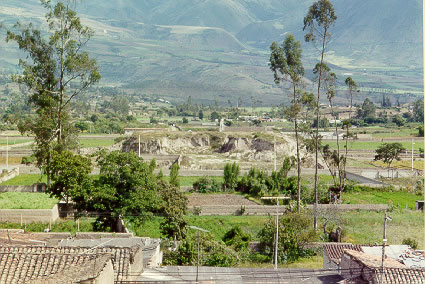 Large platform mound west of city of Atuntaqui (Mound 25); view to west. Note that mound has been used as a source of earthen fill for modern construction activities.